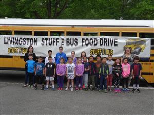 students in front of bus 