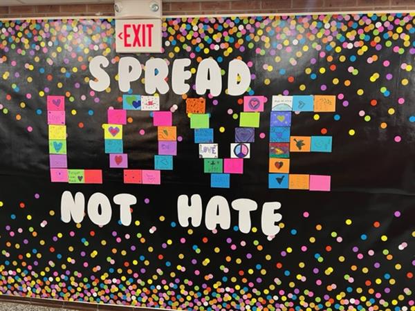 Bulletin Board with Words Spread Love Not Hate